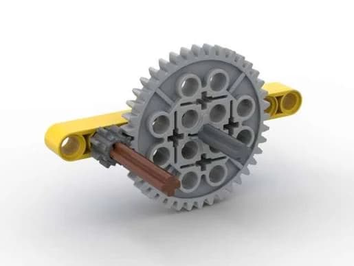 Brick-compatible mechanism with a small driving gear meshed to a much larger gear.