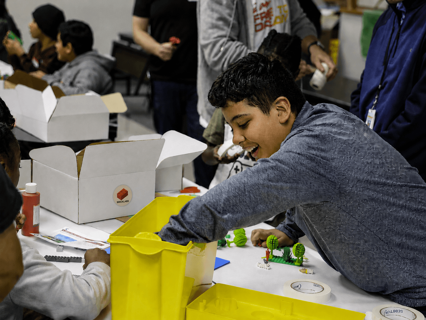 A student using BrickLabs building materials during a hands-on STEM activity.